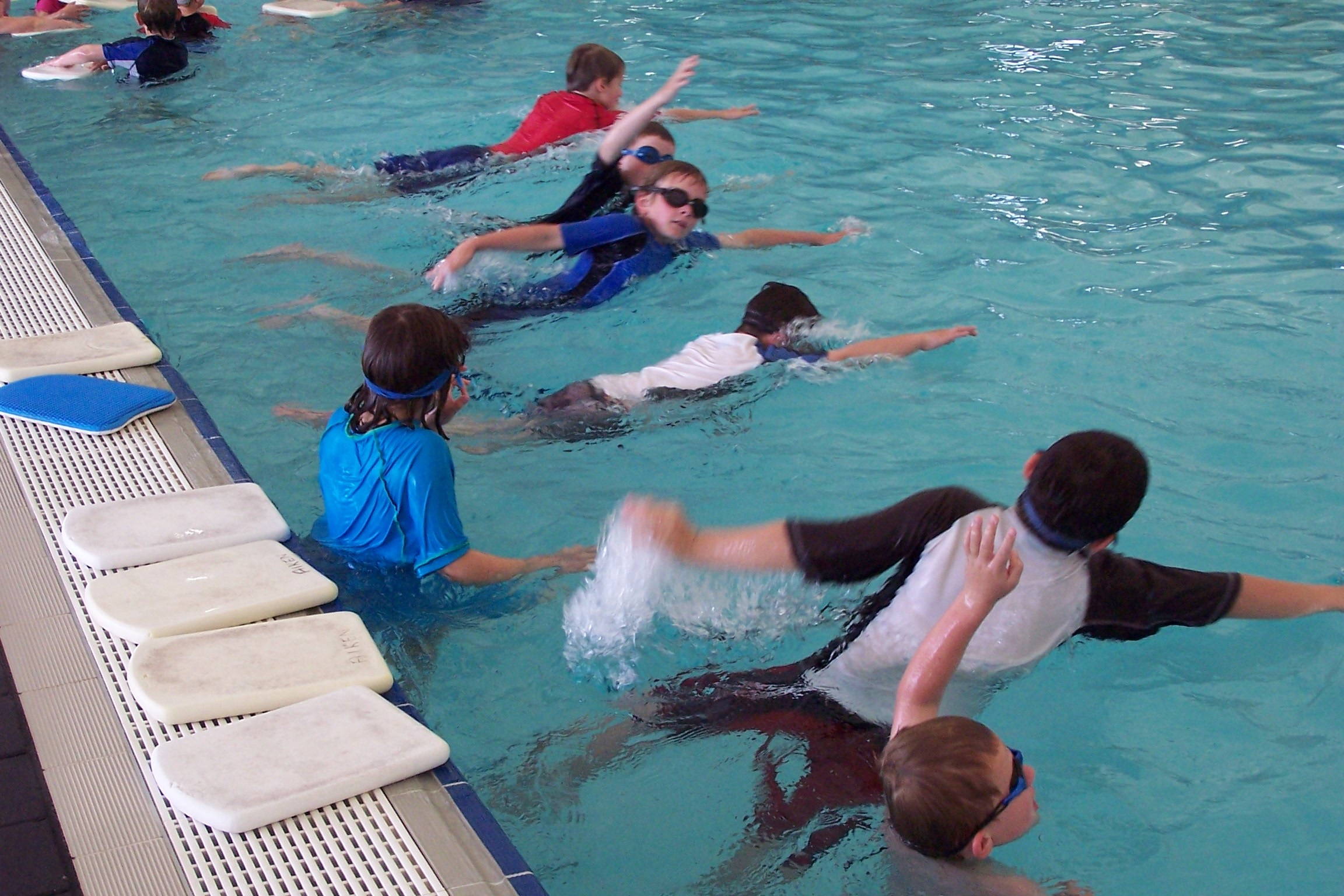 children learning to swim