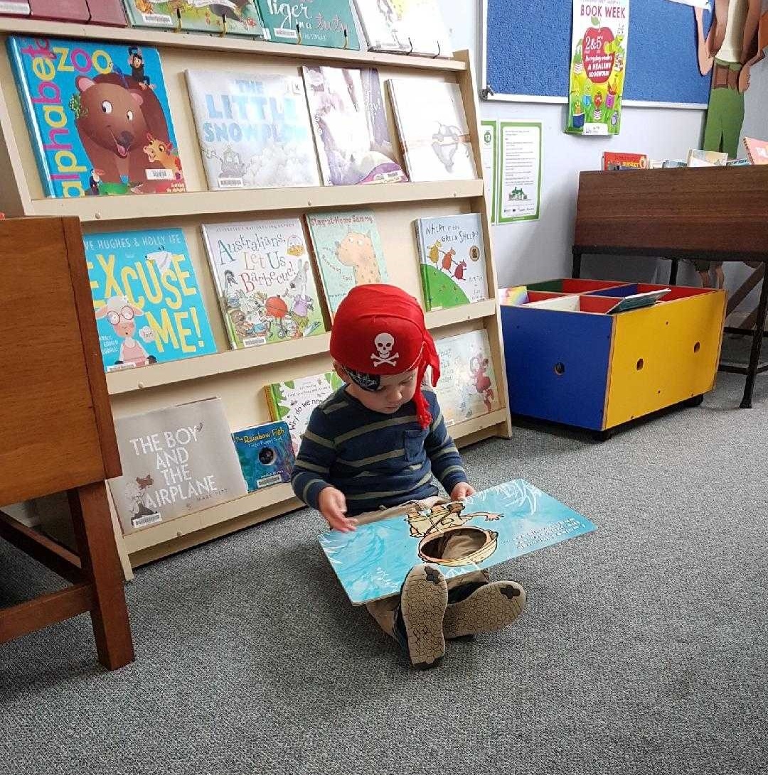 child in library childrens corner