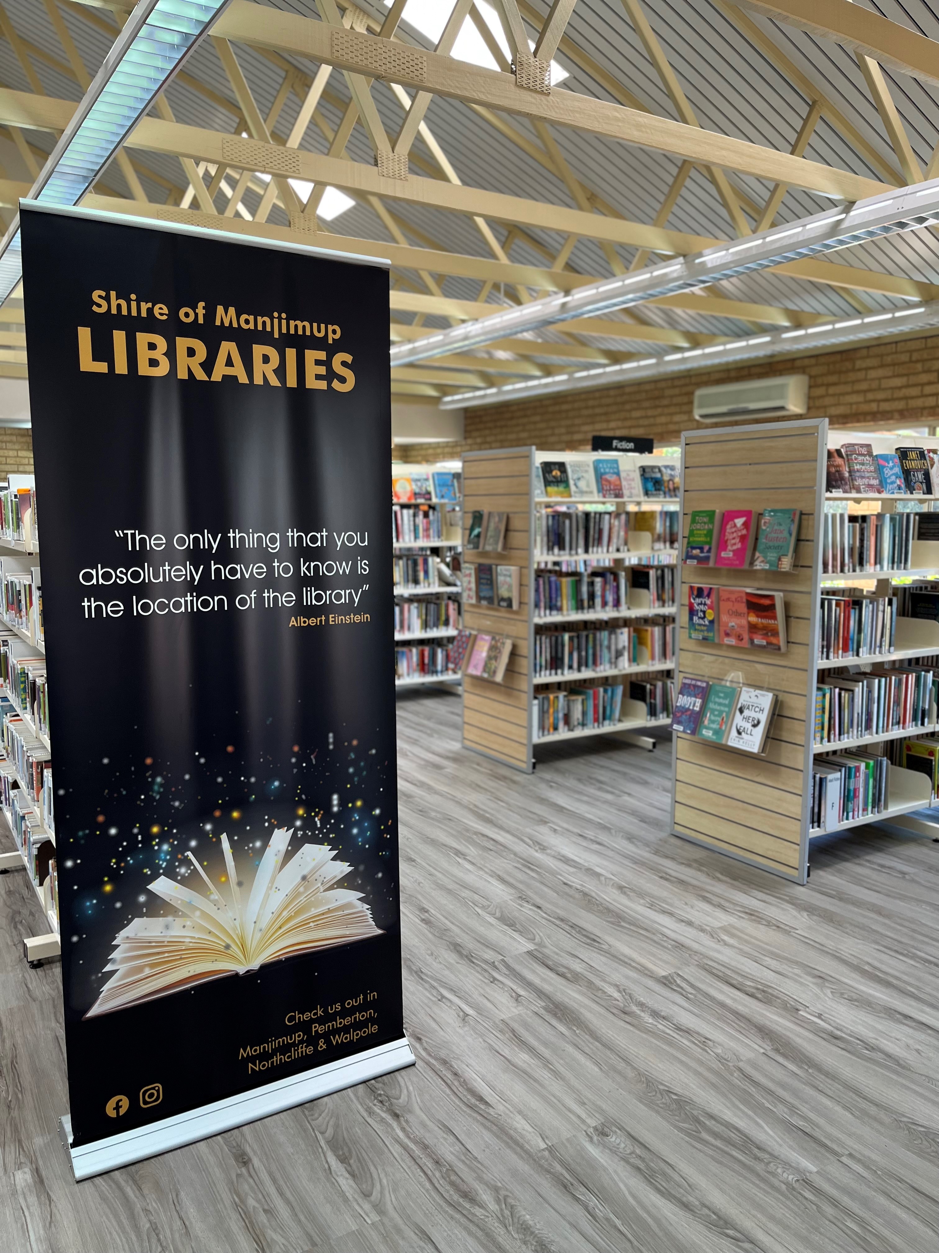 banner and books on shelves in the Manjimup Library