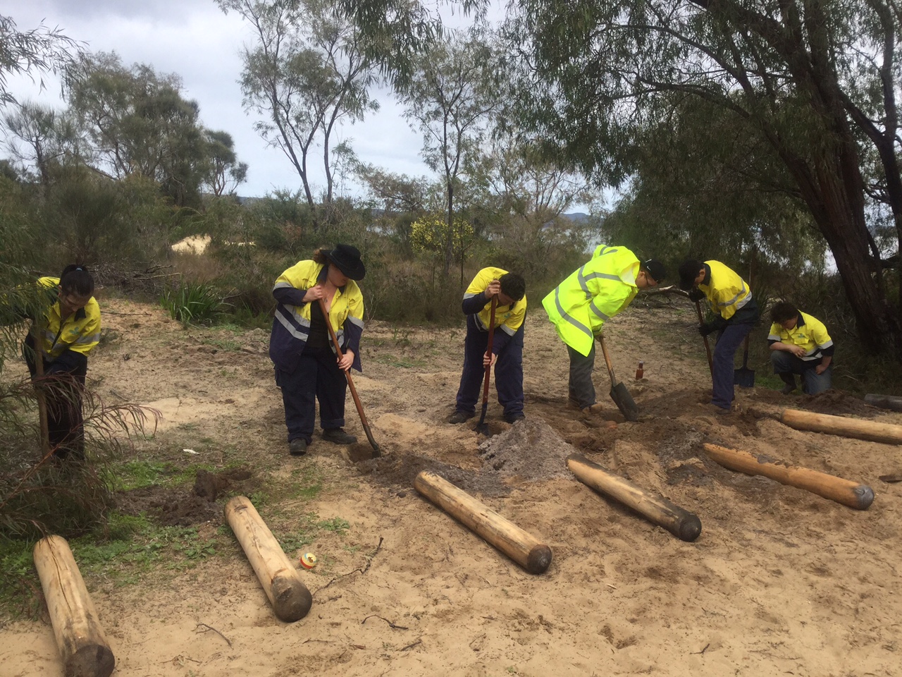 Property Care Team installing bollards on sand track