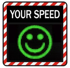 Back speed indicator sign with green smiley face.