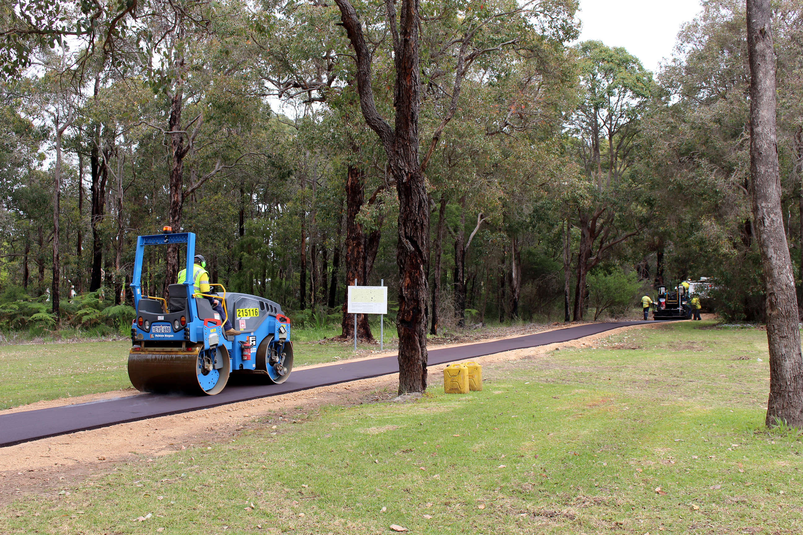 A roller compacting the bitumised section of the Deanmill Heritage Trail.