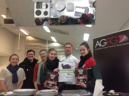 Students at a cooking challenge with celebrity chef Shaun Sheather