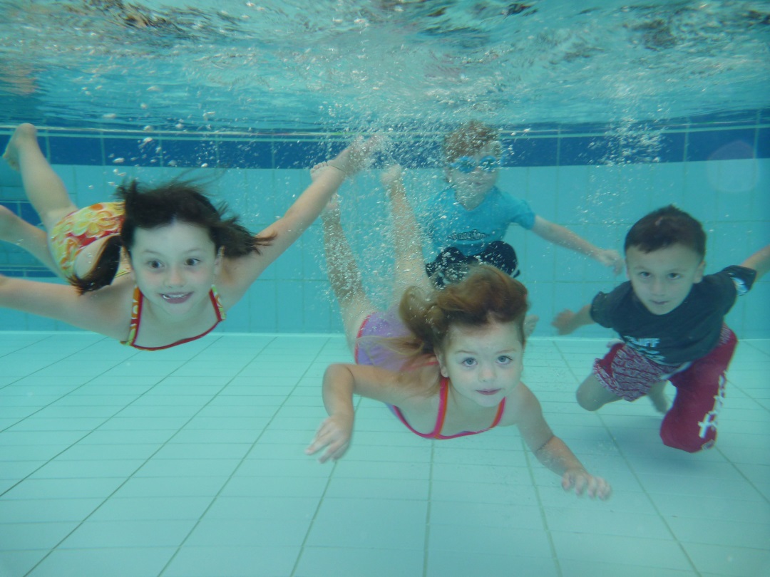children swimming underwater