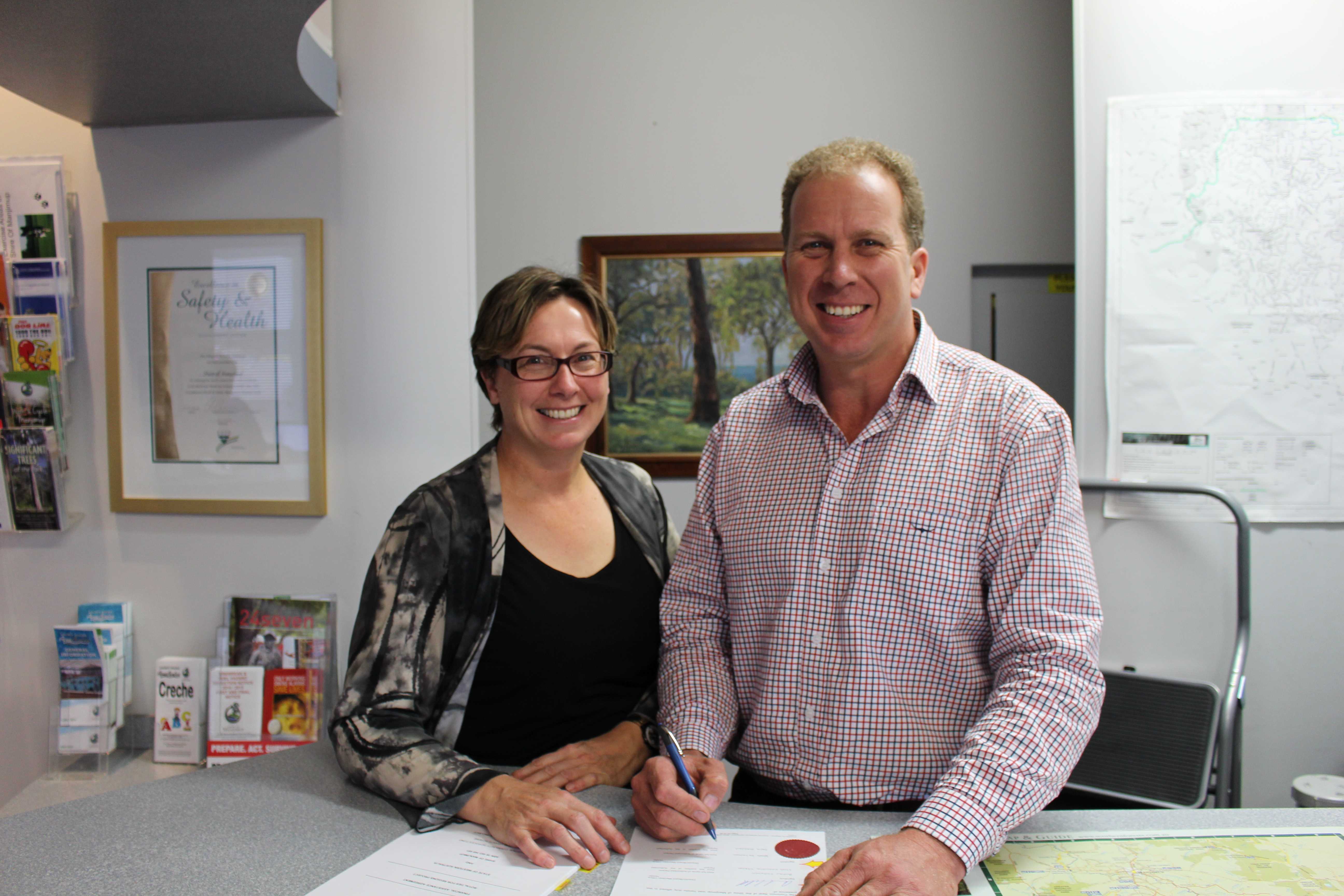 Director of Community Services and Shire President signing the funding agreement for the Seniors Housing.